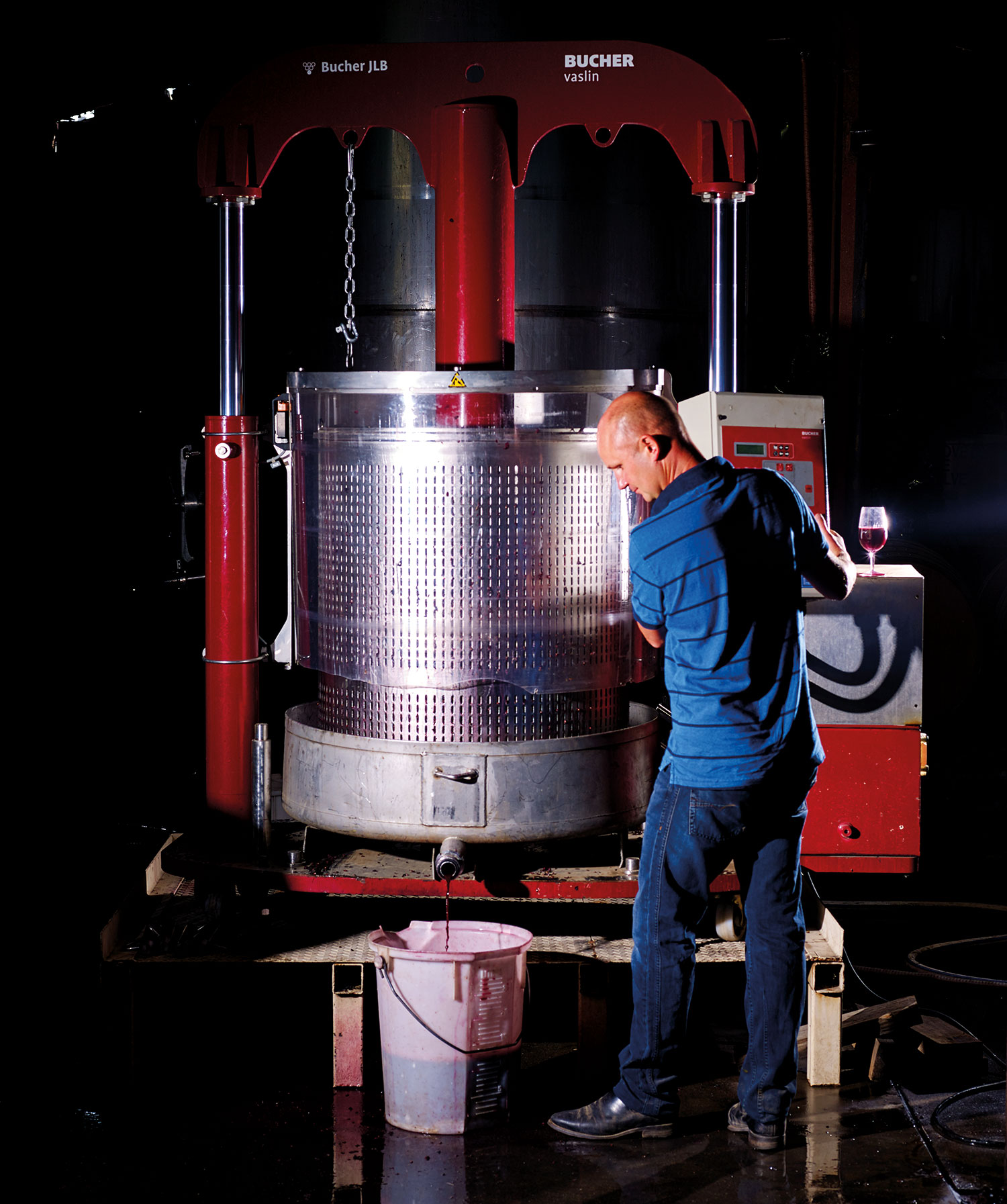 Winemaker Joel Pizzini basket pressing fruit