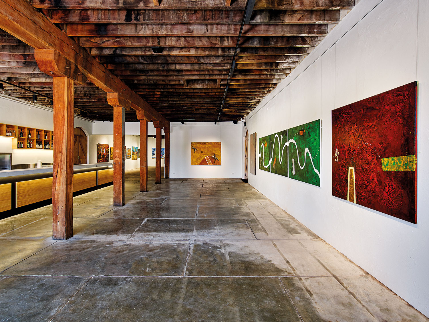 Dhungala - Trevor ‘Turbo’ Brown and Craig Charles Installation of works, featuring Craig Charles (foreground) as part of the new Rutherglen Estates winery cellar door