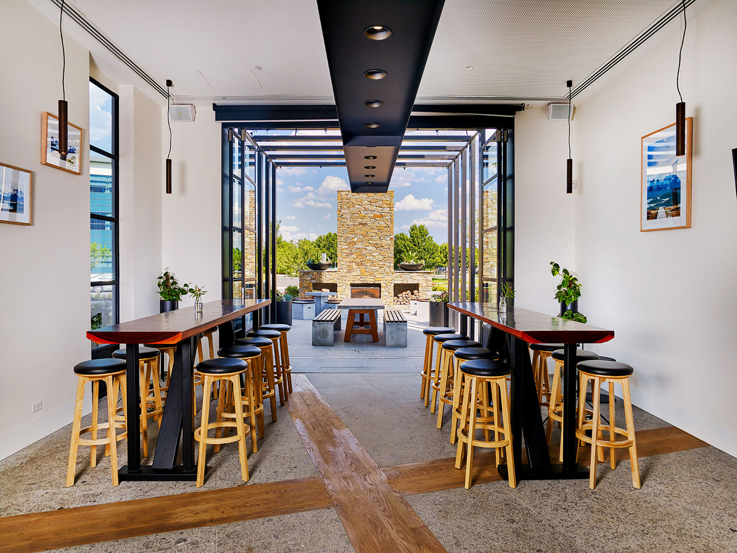 Interior view through to the al fresco dining area with its stonefaced wood fire