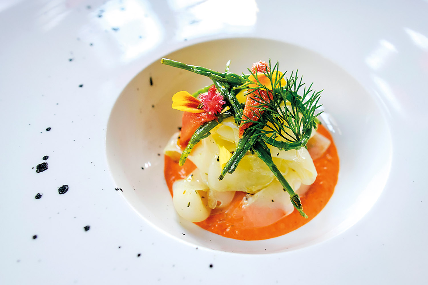 Cuttlefish Tagliatelle with smoky pepper-garlic cream, squid ink and samphire