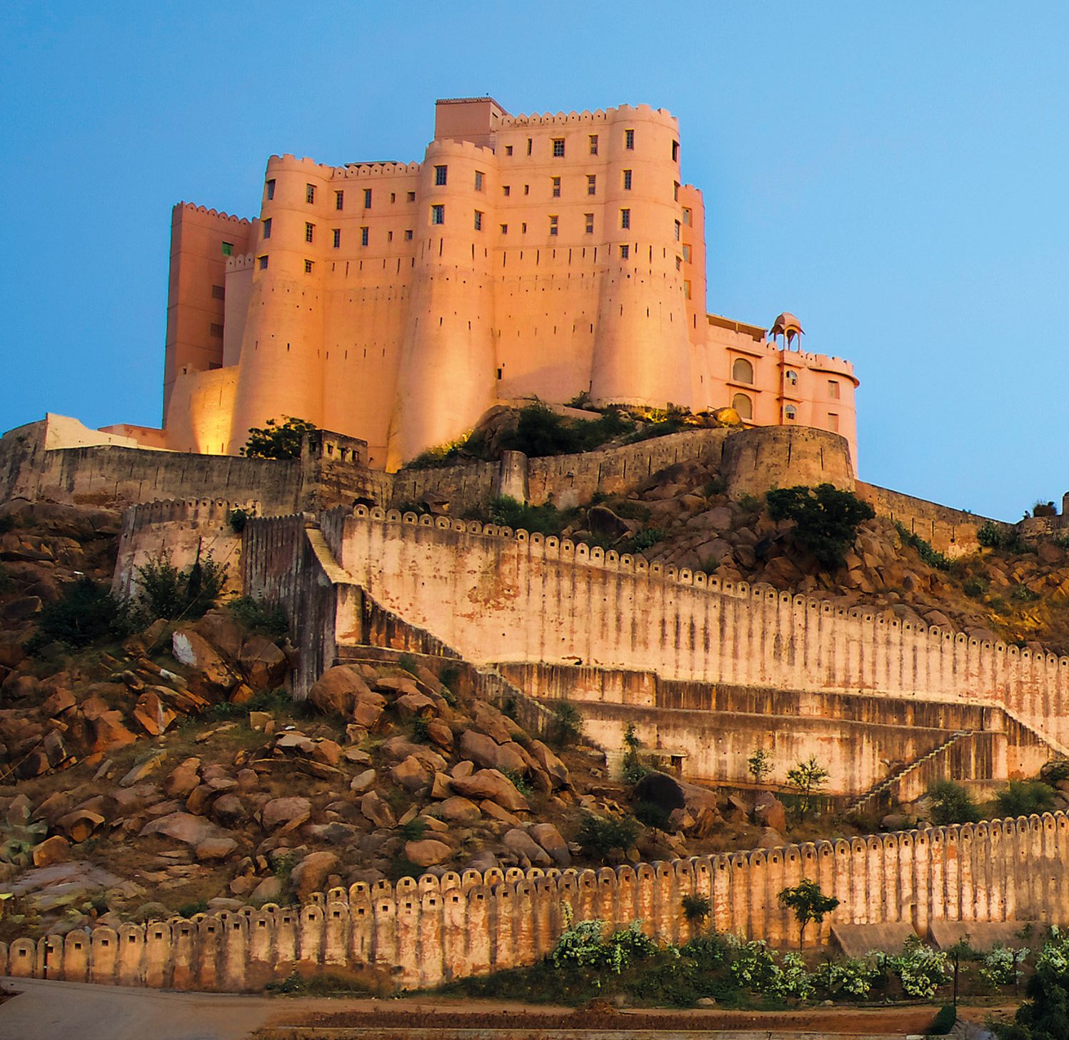Set on a granite hill, the watchful fortress looks out over the Aravalli Range