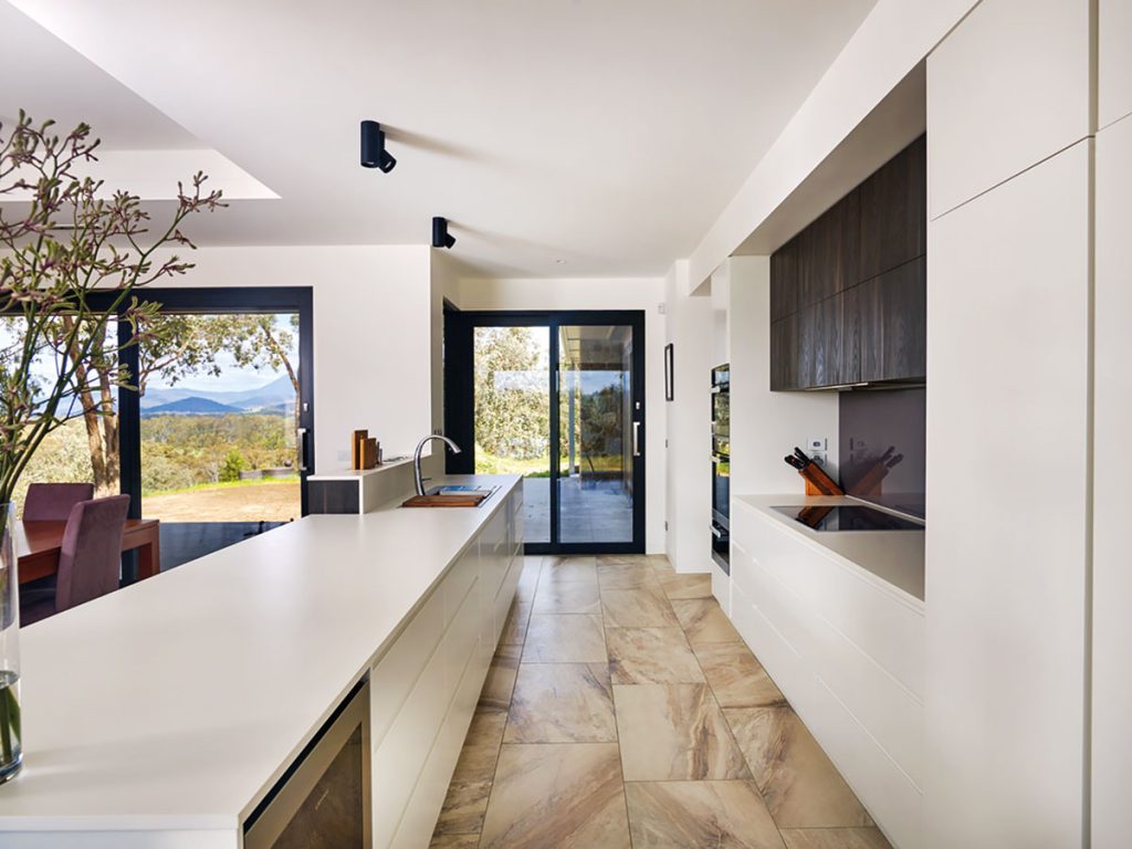 Kitchen island topped with Dekton - a unique synthesised porcelain/stone surface that features zero porosity