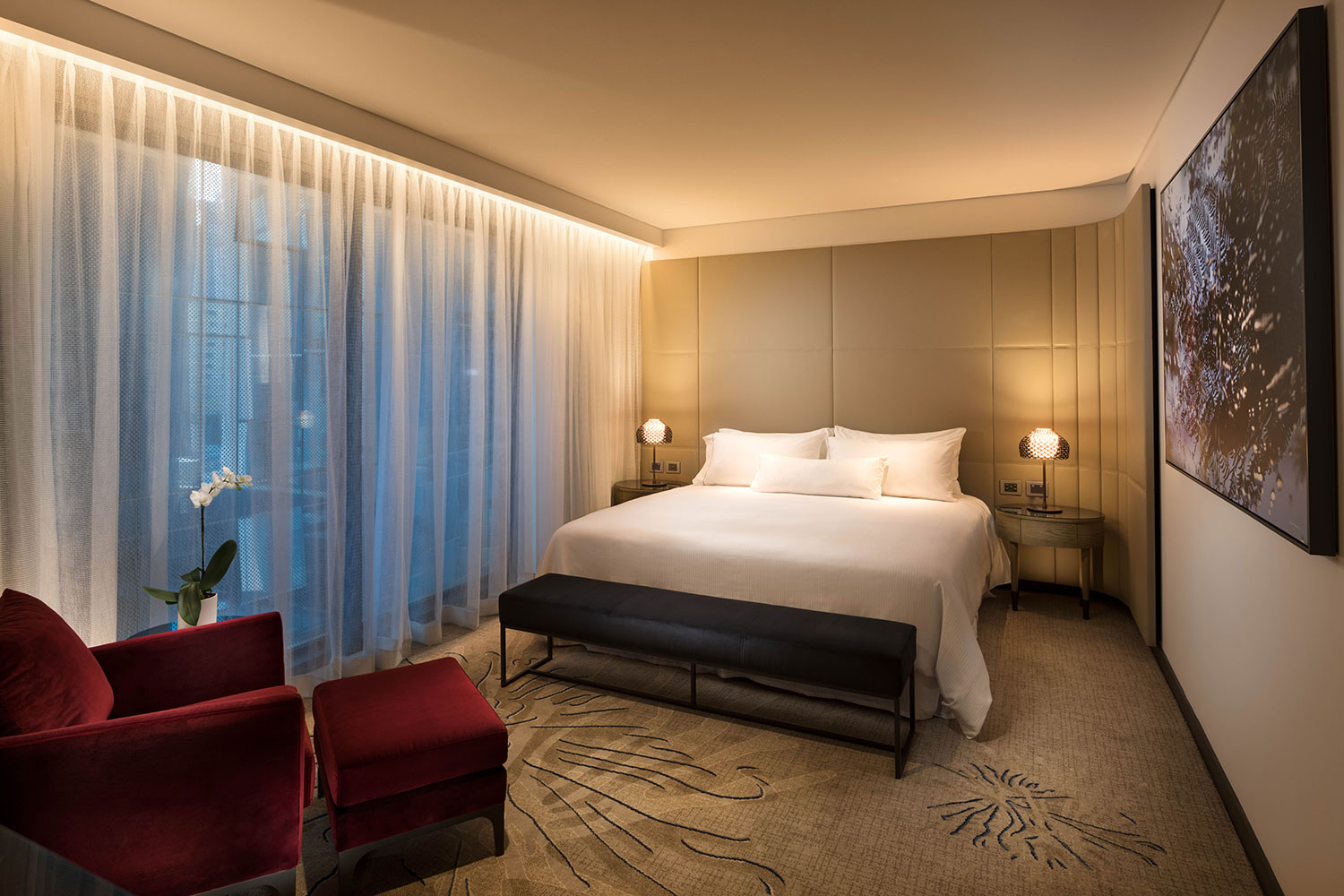 Plush interiors featuring King size beds and red velvet chairs adorn Weston's superb suites