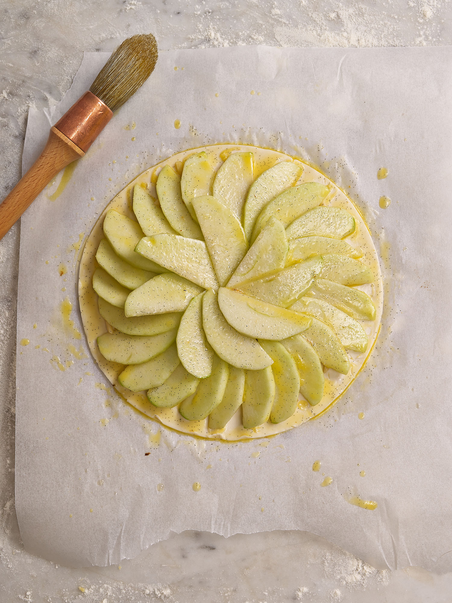 Tarte Fine aux Pommes - arranging the apples on the pastry 