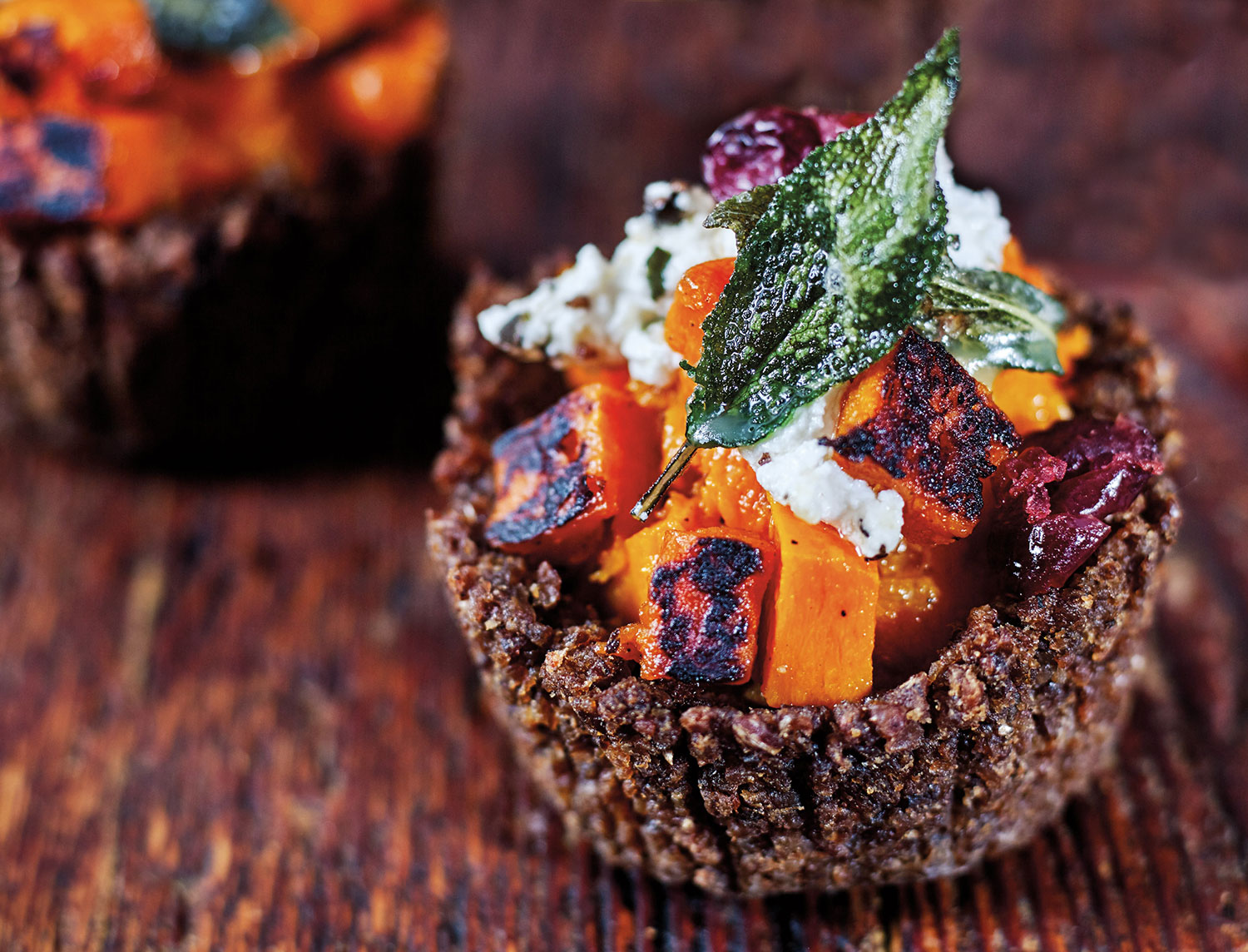 Pumpernickel Pumpkin Tartlets with burnt butter sage, Persian feta and dried cranberries