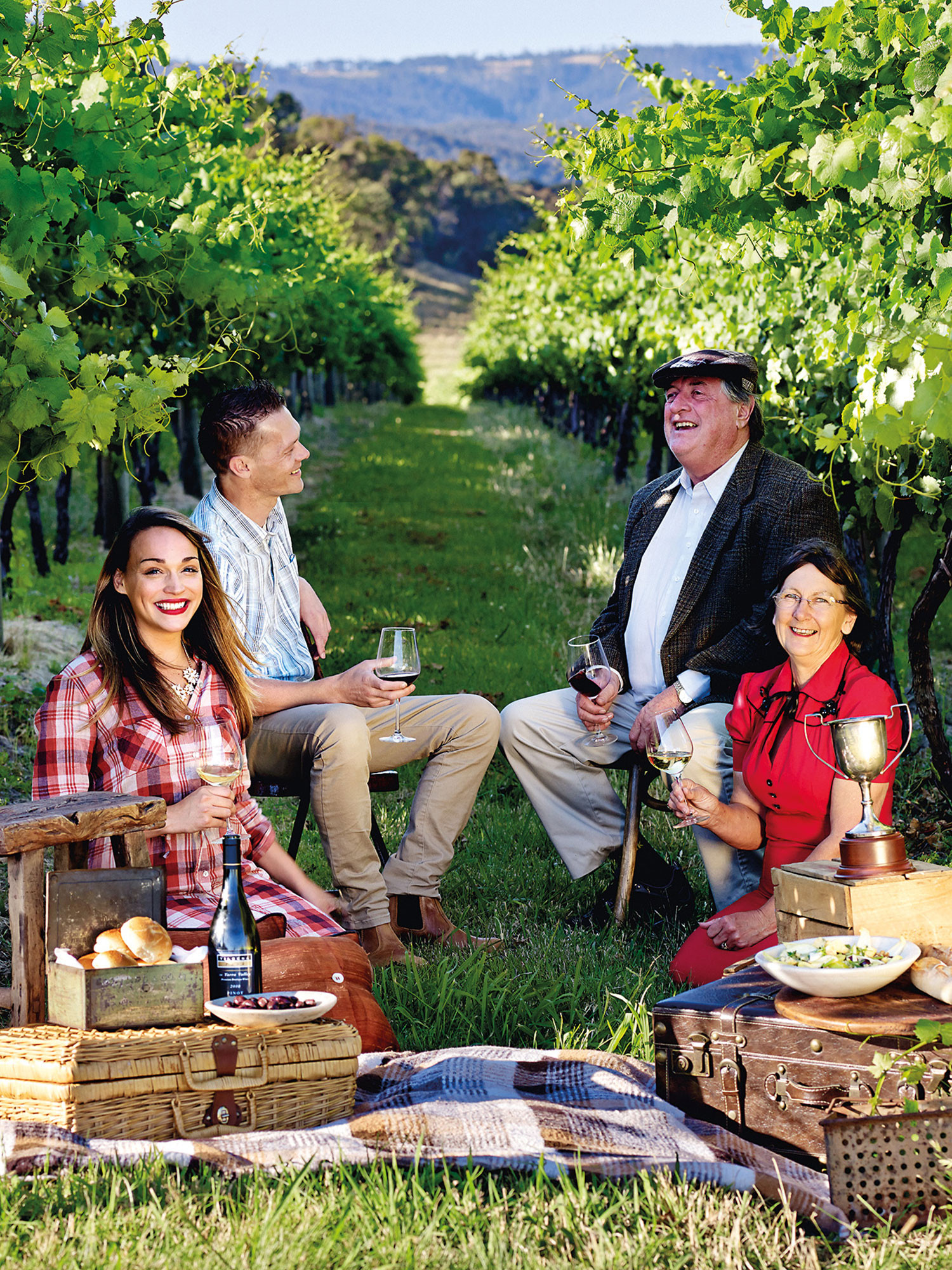Bob and Dianne Curtis (right) with friends in their Yarra Valley vineyard