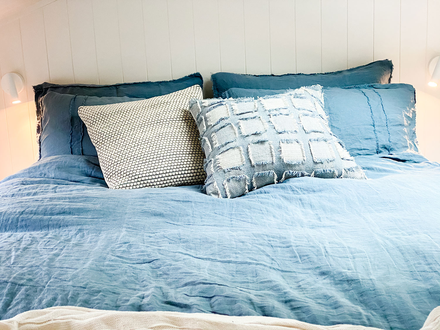 Luxe linen bedding inside T1 Wilderness (tiny house)